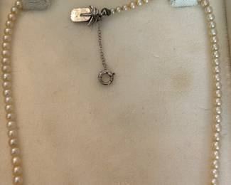 Beautiful Pearl necklace with Diamond and Sapphire clasp.