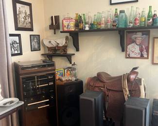 Coca Cola collectibles 
Leather horse saddle 
Vintage radio with working turn table 
