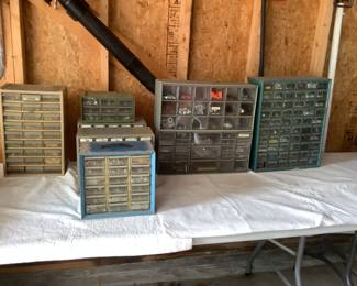  Ontainers filled with nails and other small pieces.