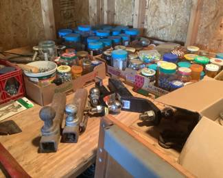 Large collection of jars filled with nails of all sizes plus other accessories