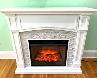 Electric media fireplace with faux stone