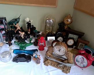 VARIETY OF CLOCKS AND AVON BOTTLES