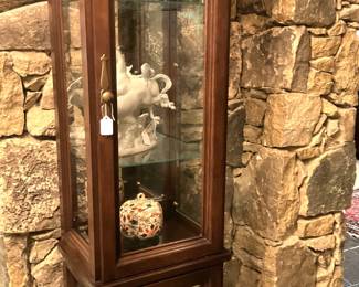 Slender curio cabinet
