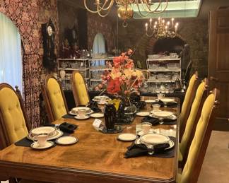 The dining table has 8 chairs, 3 leaves, and a pad.