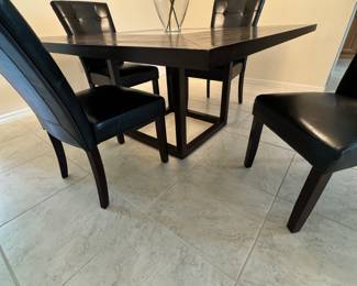 Square dining table with glass center and 4 chairs $625