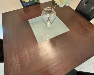 Square dining table with glass center and 4 chairs $625