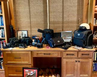 Various Binoculars, Bushnell Spotting Telescope for hunting, Cameras, Harley bags and equipment.  
The photo of the little cowboy on the pony has been pulled by the family so it is no longer for sale. 