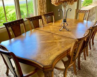 Dining table set with 2 leaves, table protector, and 8 chairs