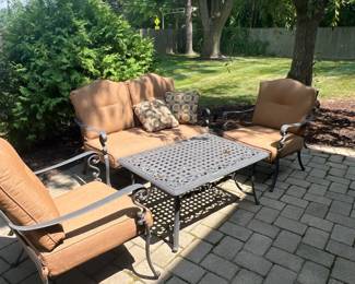 Iron Patio Set. Loveseat  and two chairs with Cushions and Table