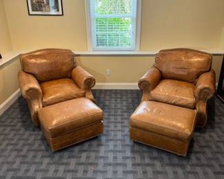 two leather chairs and ottomen (get it?)