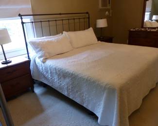 King size iron headboard with mattress & box spring, pair of night tables, lamps