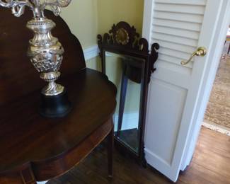 Pair of antique mahogany entrance tables and mirrors, pair of candelabras