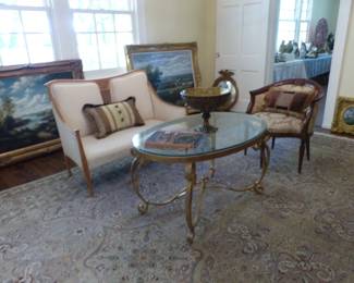 Settee, brass coffee table, accent chair, area rug