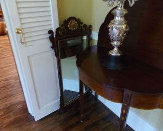 Pair of antique mahogany entrance tables and mirrors, pair of candelabras