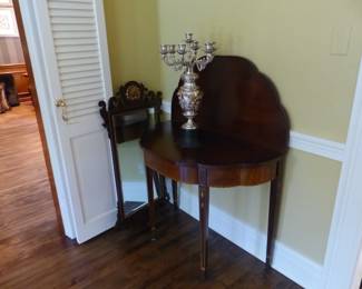 Pair of antique mahogany entrance tables and mirrors, pair of candelabras