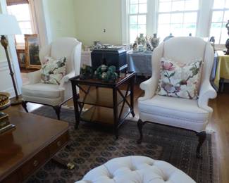 Pair of neutral wing chairs, decorative pillows, mahogany 3 tier side table