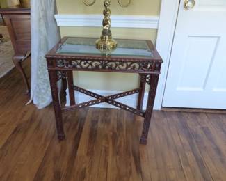 Carved wood, glass top end table, brass lamp