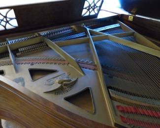 Antique baby grand player piano with music reels