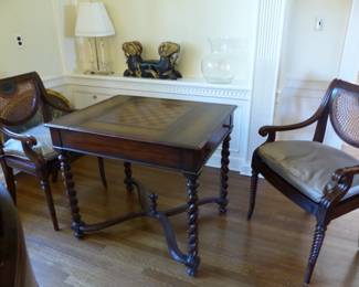 Theodore Alexander game table with 2 chairs, bric-a-brac on shelf