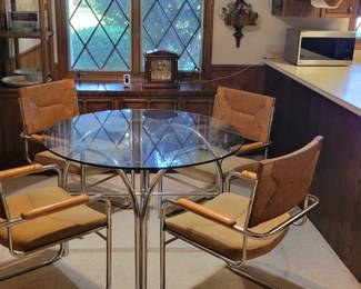 Round glass top table and chairs
