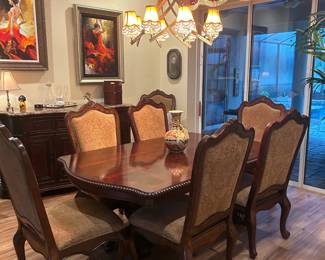 Universal Mahagony dining room table with 6 chairs, two armchairs, marble top buffet, two table Leaves and protective padding 