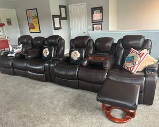 Dark brown leather sectional sofa with 4 electric recliners and two mini tables with lights and outlets.