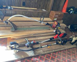 Several weed eaters.