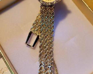 14 kt gold and diamond watch