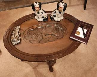 Glass top carved table, Staffordshire dogs