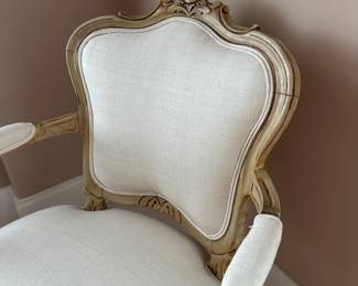 Antique carved wood Louis XVI - style armchair in cream