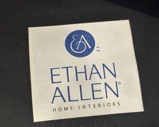 Pair of brown leather chairs with ottomans by Ethan Allen