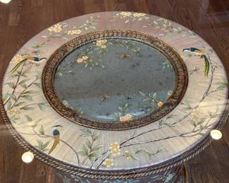 Lillian August Table adorned with flowers and birds with octagonal tempered glass top; 55.25" x 30" h