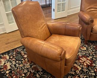 Pair of brown leather chairs with ottomans by Ethan Allen