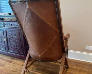Brown Leather studded chair with ottoman, by Stickley