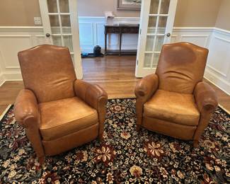 Pair of brown leather chairs with ottomans by Ethan Allen