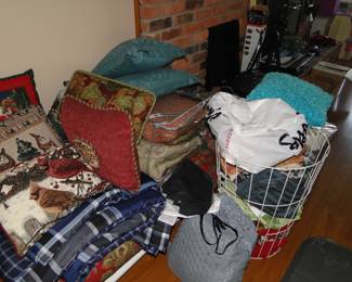 Underneath all of these comforters, and pillows, is a very nice sitting down bench