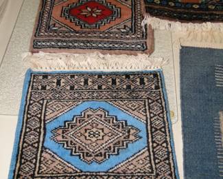 Lots of great vintage rug samples, small little rugs for tiny little rooms