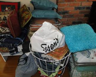 Pile of pillows and some other home good neccesities