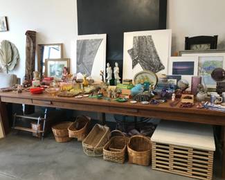 our long table of fun vintage pieces, collectibles, artwork, books, baskets, coffee table