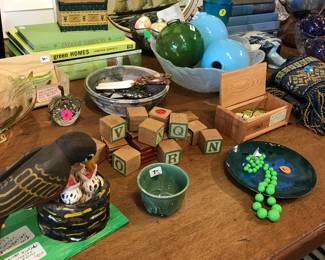 collection of green vintage pieces, bird folk art, pottery, enamel, handmade fishing lures