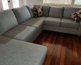 A fabulous Grey Sectional...in like new condition by Stanton