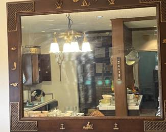 Great Asian large mirror with brass applied pieces and corner brackets.