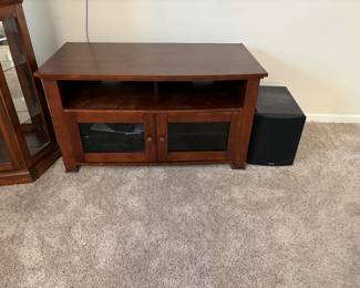 Entertainment table.  But, more importantly the subwoofer will keep the neighborhood up when you watch Jurassic Park.