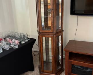 Curio cabinet for all the "necessary" stuff that she collects.