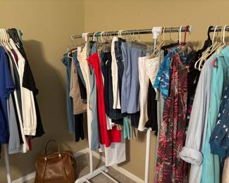 And even more clothes.  Note the purse / travel bag.  It can hold anything but money.  Guys understand.