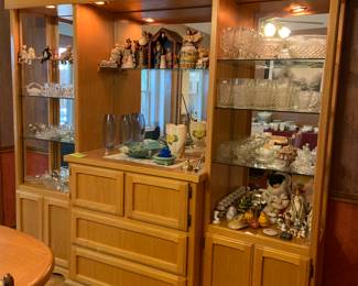 large oak , lighted display cabinet with mirrored back  