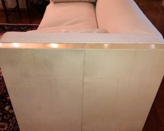 Pair of ivory upholstered sofas with lacquered parchment sides