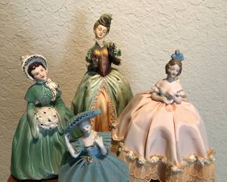 Vintage Figurines Front and L-R (Small Blue Porcelain figurine marked JAPAN, Figurine with bouget -unmarked, Tall Figurine in Center marked Antonio Borsato Italy, Figurine in Pink is a pin cushion.)