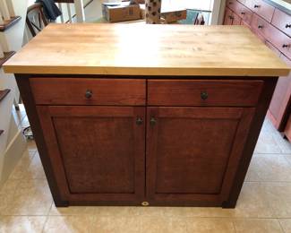 Kitchen Island with Butcher Block Top and ample storage. Island is on casters, so you can move it around freely. Cabinet is 50in L | 26.1/4in D | 41in H