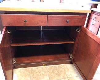 Interior view of Kitchen Island. Doors on both sides make it easy to access stored  items.